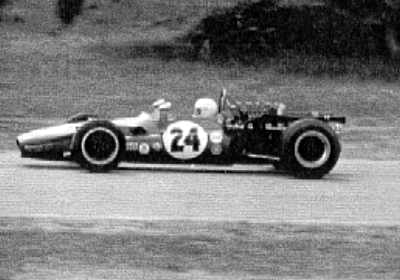 Dan Harper's Lola T140 at Laguna Seca 1971. Although it was entered as a T140, the top radius rod mount looks like that of a T142. Copyright Al Moore 2002. Used with permission. Dan Harper's Lola T140 at Laguna Seca 1971. Although it was entered as a T140, the top radius rod mount looks like that of a T142. Copyright Al Moore 2002. Used with permission.