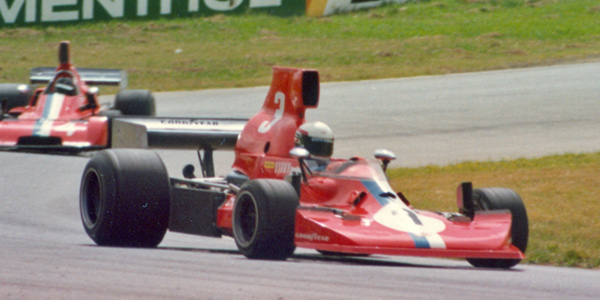 Warwick Brown in the VDS Lola T430 leads Peter Gethin in the VDS Chevron B37 at Oran Park in February 1977.  Copyright Glenn Moulds 2005. Used with permission.