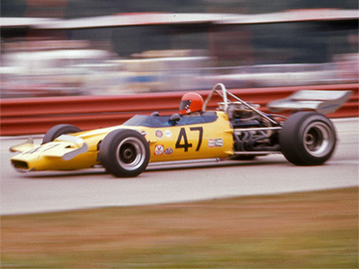 Evan Noyes in his new McLaren M18 at Road America in 1971. Copyright Richard A Reeves 2013. Used with permission.