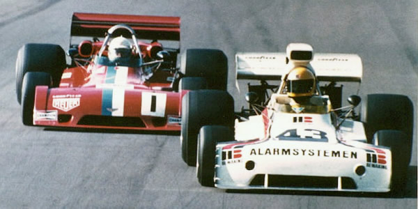 Teddy Pilette in the BDS Chevron B28 about to pass the ex-VDS Chevron B24 of Wunderink as they approach Shaws Corner, Mallory Park 1974.  Copyright Mark Scanlon 2005.  Used with permission.