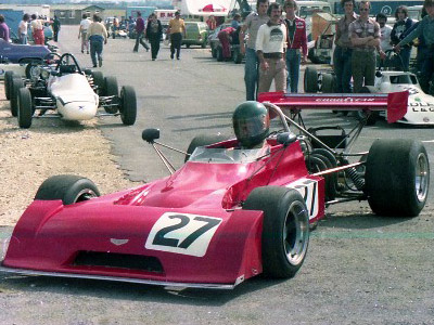 Patrick Sumner takes his Chevron B27 through the paddock at Thruxton in August 1976. Copyright Andrew Scriven 2010. Used with permission.