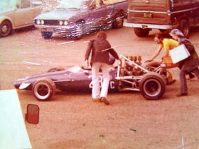 Richard Shepard's Chevron being pushed through the paddock at Sears Point in 1976. Copyright Richard Shepard 2010. Used with permission.