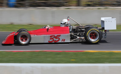Philippe Reyns in his Chevron B27 at Road America in May 2016. Licenced by Royal Broil under Creative Commons licence Attribution-ShareAlike 2.0 Generic (CC BY-SA 2.0). Original image has been cropped.