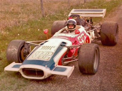 Robert Metcalf in his Lola T140 at the edge of the paddock at Aloe Field, an airport track near Victoria, Texas, in 1974. Copyright Robert Metcalf 2008. Used with permission.