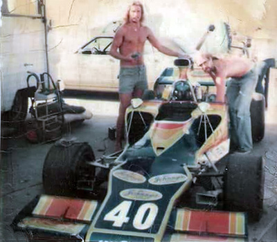 Two of Joe Schultz' crew work on his Lola T300. Copyright Darrell Smart 2022. Used with permission.