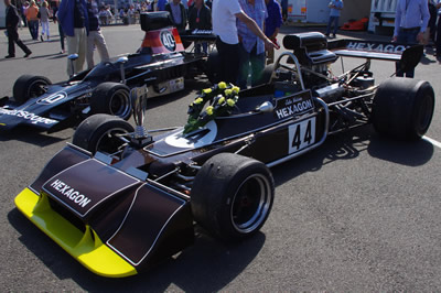 Simon Hadfield's Hexagon-liveried Trojan T101 fresh from winning its race at the Silverstone Classic in 2012. Licenced by David Merrett under Creative Commons licence Attribution 2.0 Generic (CC BY 2.0). Original image has been cropped.