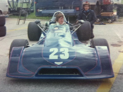 Chip Mead in his Chevron B27 at Gimli in 1974. At the rear wheel is mechanic Keith "Wombat" Devereux. Copyright Brian Williams 2020. Used with permission. Chip Mead in his Chevron B27 at Gimli in 1974. At the rear wheel is mechanic Keith "Wombat" Devereux. Copyright Brian Williams 2020. Used with permission.