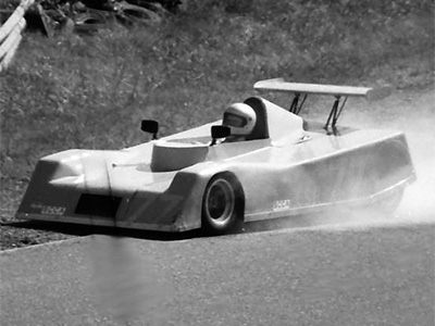 Jerry Booker's C Sports Racing Brabham at Brainerd in 1982. Copyright Jerry Winker 2019. Used with permission.